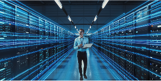 A data center manager walking through a cloud environment