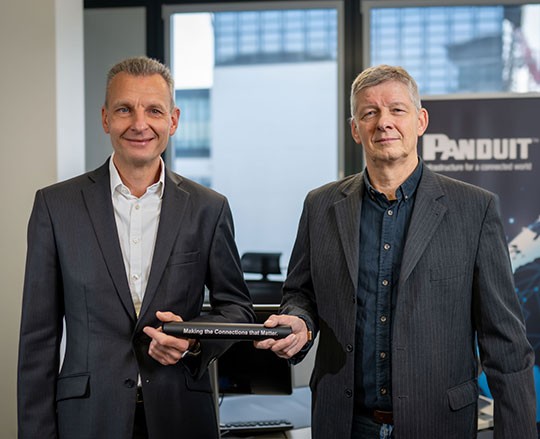 Baton handover Ralph Lolies and Jens Holzhammer