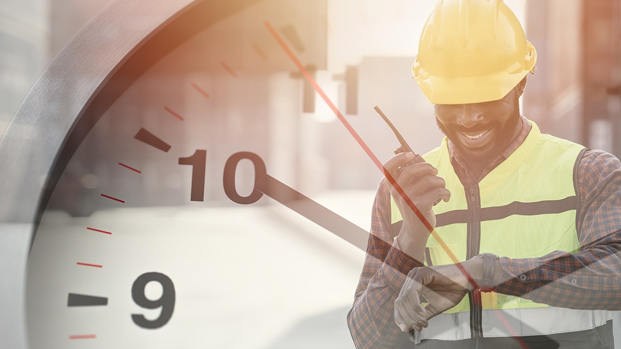 blog-logistics-1280x720 Man in a hard hat and safety vest using a radio and looking at his watch, superimposed on a closeup of a clock