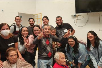 Group of Panduit LATAM employees and senior citizens smiling