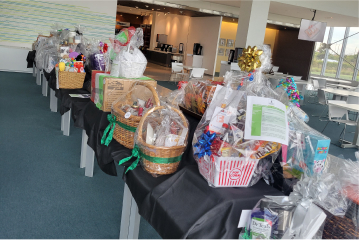 Table with baskets filled with items for the raffle