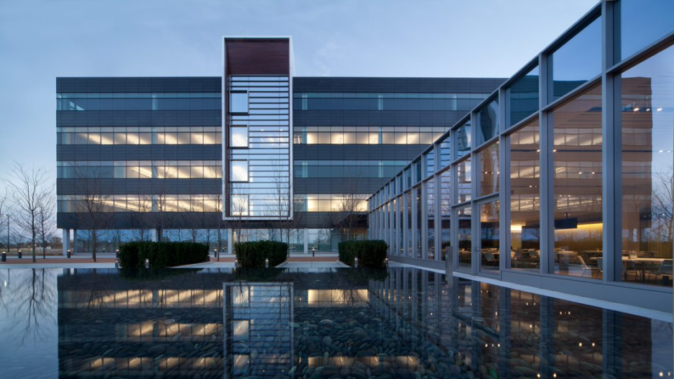 The Panduit world headquarters building with a reflecting fountain in the foreground