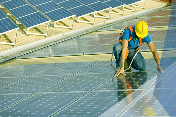 Construction workers working on solar installation 