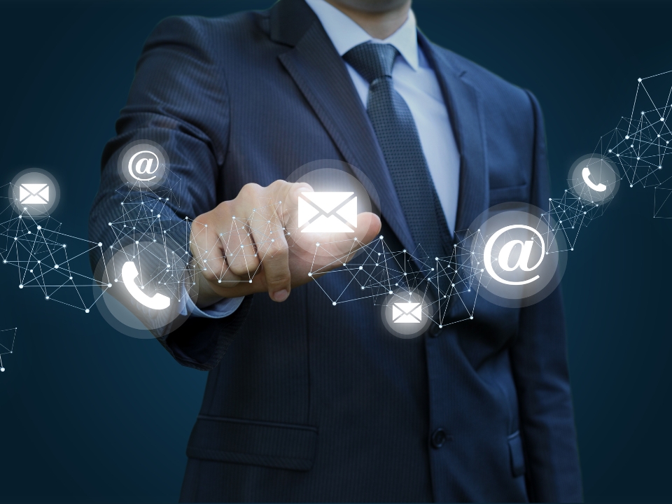 Business person clicks on the email icon to contact the company