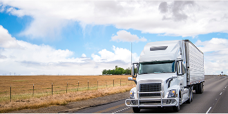 Semi-truck driving through rural area